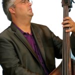 Mickey Harris with Rhonda Vincent at the Outer Banks Bluegrass Festival - photo by Woody Edwards
