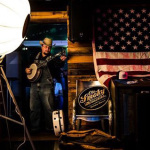 Jereme Brown with The Po' Ramblin' Boys warming up to perform at The Generator in Copenhagen