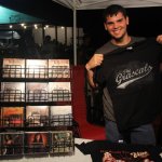 Jackson Hagwood helping out with The Grascals\' merch at Preddyfest 2013 - photo by Laura Tate photography