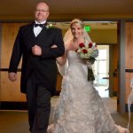 Ray Johnson escorts his daughter Rachel, down the aisle - photo by Ted Lehmann