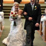 Mr. and Mrs. Christopher Boyd walking up the aisle - photo by Ted Lehmann