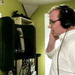 Andy Rigney recording lead vocals at Dark Shadow Recording