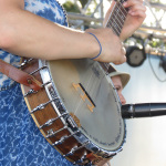 Courtney Hartman with Della Mae at ROMP 2013 - photo by Terry Herd