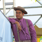 Dom Flemons with carolina Chocolate Drops watching the show at ROMP 2013 - photo by Terry Herd