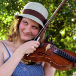 Kimber Ludiker with Della Mae at ROMP 2013 - photo by Terry Herd