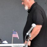 John Holder of Blue Ridge Sound keeping the sound going in adverse conditions at Red, White & Bluegrass (July 4, 2013) - photo by Bill Warren