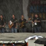 Larry Cordle & Lonesome Standard Time brave the deluge at Red, White & Bluegrass 2013 - photo by Bill Warren