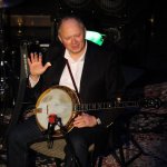 Jim Mills is introduced at the Earl Scruggs tribute concert (1/11/14) - photo by John Goad