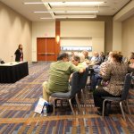 Cindy Baucom leads the constituency meeting for bluegrass broadcasters during World of Bluegrass 2013 - photo by Tara Linhardt