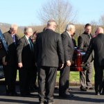 Pall bearers carry George Shuffler to his final resting place (4/9/14) - photo by Becky Johnson