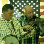 Steve Dilling and Justen Haynes with Sideline at IBMA 2013 - photo by Daniel Mullins