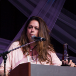 Donna Ulisse accepts her Songwriter of the Year Award at the 2016 Wold of Bluegrass - photo © Tara Linhardt