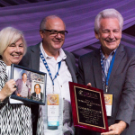 Kitty Kuykendall accepts the Distinguished Achievement Award for Bluegrass Unlimited presenting at the Special Awards at the 2016 Wold of Bluegrass - photo © Tara Linhardt