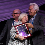 Kitty Kuykendall accepts the Distinguished Achievement Award for Bluegrass Unlimited presenting at the Special Awards at the 2016 Wold of Bluegrass - photo © Tara Linhardt