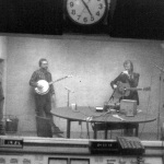 Lee Michael Demsey looks in the WAMU studio as Alan O'Bryant and Tony Rice perform