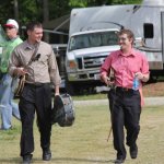 Jason Davis and Chris Davis head for the stage and a show with Junior Sisk at the Willow Oak Festival (April 2013) - photo by Laura Tate Photography