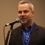 Chris Joslin from the IBMM introduced the talk with the Hall of Fame members Jesse McReynolds, Tom Gray, and Larry Sparks at Wide Open Bluegrass 2016 - photo © Tara Linhardt