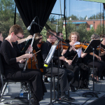 Symphony of the Mountains getting ready to perform with the Kruger Brothers at Wide Open Bluegrass 2016 - photo © Tara Linhardt