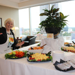 Kitty Kuykendall laying out a spread for the Leadership Bluegrass Master Class at World of Bluegrass 2015 - photo by Becky Johnson