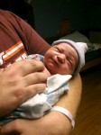Newborn Mason McKinnon in his father's arms (November 7, 2012)