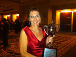 Karen Miller Porter with her Best in Show trophy for the Bill Monroe Centennial campaign at the Kentucky Travel Industry Association convention in 2011