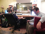 The excitement of the studio life! Stephen Mougin at the board while Mark Rigney scans his computer during tracking sessions for The Rigneys.