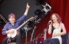 Béla Fleck and Abigail Washburn on stage with their son, Juno - photo by Dave Roberts
