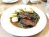 Beef on spinach with potato dumplings in Prague
