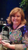 Andrea Roberts with her 2015 Momentum Award for mentoring at World of Bluegrass
