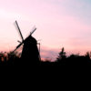 Windmill silhouetted against the darkening sky heading to Copenhagen