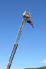 Amber Collins soars above the crowd at HoustonFest 2016 as she sings the National Anthem from a Galax Fire Department ladder truck (June 11, 2016) - photo by Ernest White