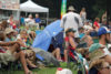Audience enjoying the music while ducking the rain at the 2nd Annual Susie's Cause Bluegrass-Folk Festival in Maryland - photo by Mike Goglia