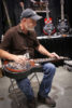 Paul Beard playing his new Copper Mountain guitar in the Exhibit Hall at World of Bluegrass 2016 - photo by Frank Baker